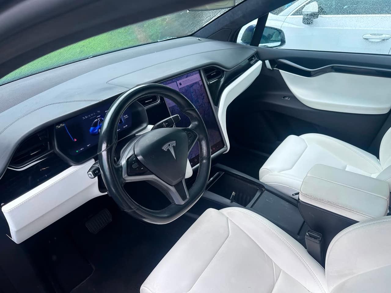 White leather SUV interior AFTER full detail by Detail Jockey — pristine white leather seats and clean floor, Flemington NJ